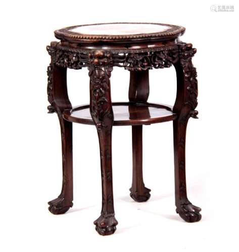 A 19TH CENTURY PROFUSELY CARVED CHINESE HARDWOOD CIRCULAR JA...