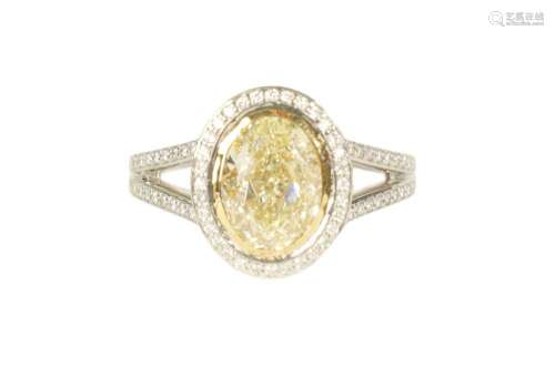 A LADIES 18CT WHITE GOLD 2.5CT FANCY LIGHT YELLOW OVAL SOLIT...