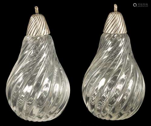 A PAIR LATE 19TH CENTURY CUT GLASS SILVER TOPPED SENT BOTTLE...