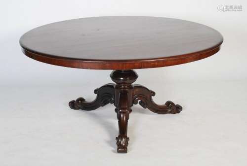 A Victorian mahogany centre table, the oval shaped top raise...