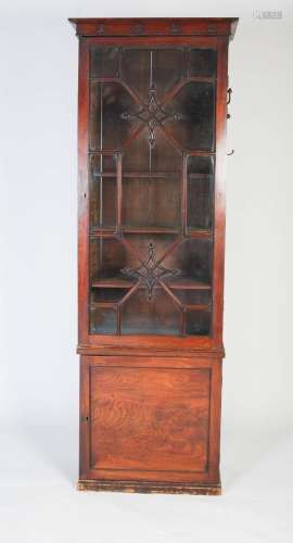 A 19th century mahogany bookcase / estate cabinet, topped by...