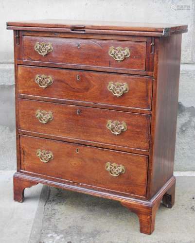 A George III mahogany bachelors chest, the hinged rectangula...