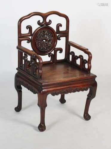 A Chinese carved darkwood armchair, late 19th/ early 20th ce...