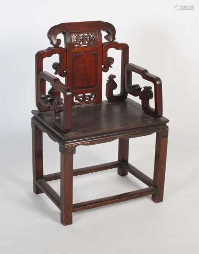 A Chinese carved darkwood armchair, late 19th/ early 20th ce...