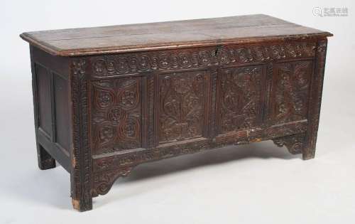 A 17th century and later oak mule chest, the carved floral p...