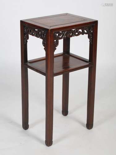 A Chinese darkwood urn stand, Qing Dynasty, the plain top wi...