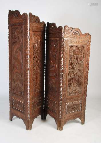 A 20th century South East Asian carved teak four panel room ...