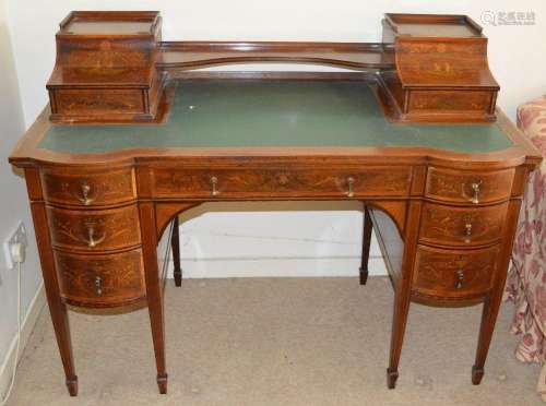 An Edwardian mahogany and marquetry inlaid writing desk, the...