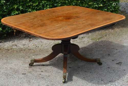 A 19th century rosewood snap top supper table, the hinged ro...
