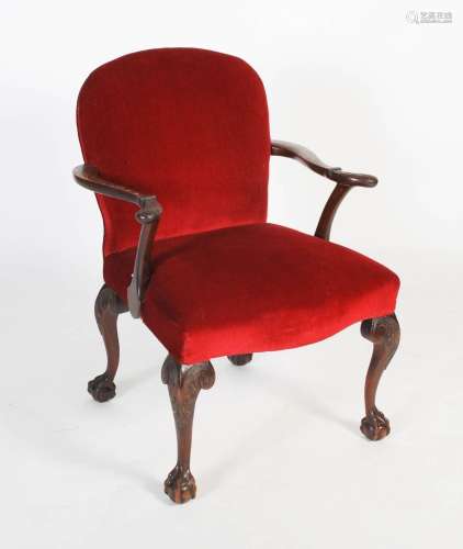 A 19th century carved mahogany armchair, the curved back wit...