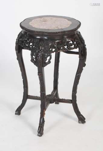 A Chinese carved darkwood and marble tall jardiniere stand, ...