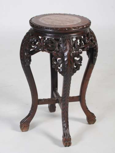 A Chinese carved darkwood and marble jardiniere stand, the r...