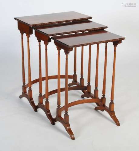 A nest of three Regency rosewood occasional tables, the tops...