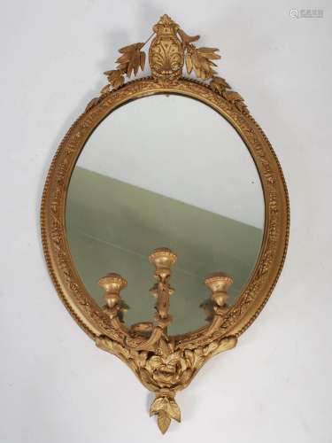 A late 19th / early 20th century gilt gesso oval girandole w...