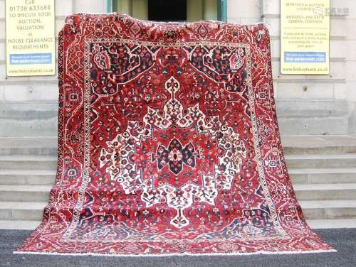 An early 20th century Persian Bakhtiari carpet, with a deep ...