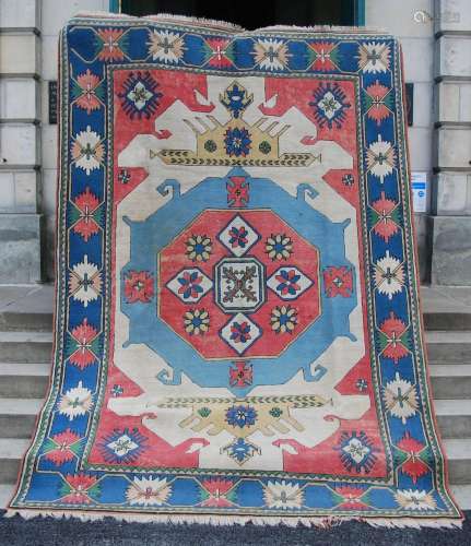 A 20th century Persian carpet, the pink, pale blue and cream...