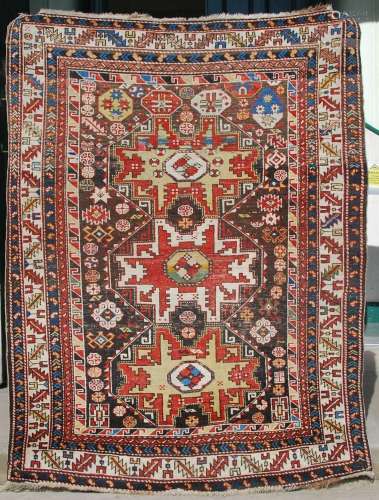 An early 20th century Persian carpet, the madder field with ...