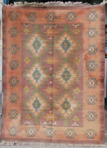 A 20th century Middle Eastern flatweave carpet, the madder f...
