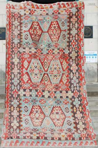 A fine flatweave Kilim carpet, the turquoise and rust red fi...
