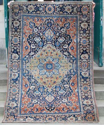 A Persian rug, late 19th / early 20th century, the abrashed ...