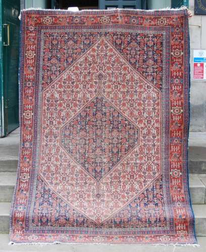 A Persian rug, late 19th / early 20th century, the rectangul...