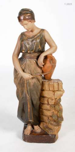 An early 20th century polychrome plaster figure of a female ...