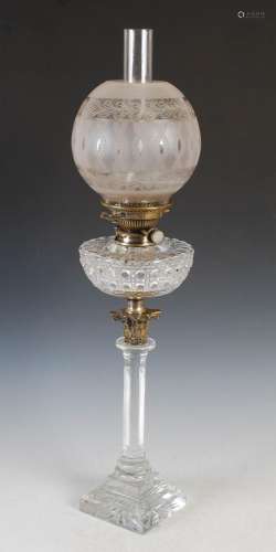 A Victorian glass and brass mounted oil lamp, with cut clear...