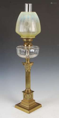 A late 19th / early 20th century brass oil lamp, with clear ...