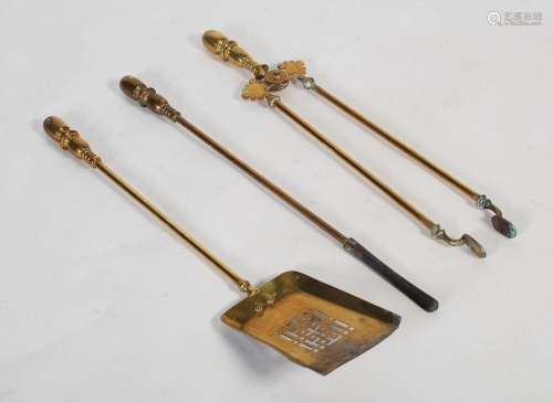 A set of three late 19th century brass fire irons in the Aes...