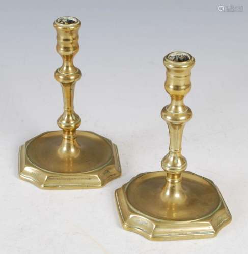 A pair of antique brass taper candlesticks, 15cm high