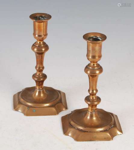 A pair of antique coppered candlesticks, 17cm high