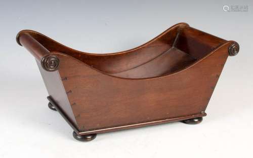 A George III style mahogany cheese coaster, of concave form ...