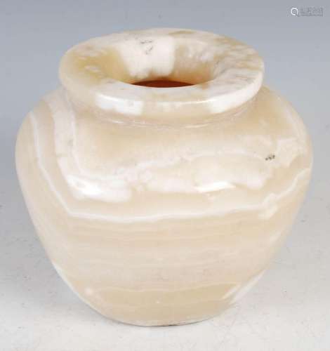 A banded alabaster squat jar, with a broad and flat circular...