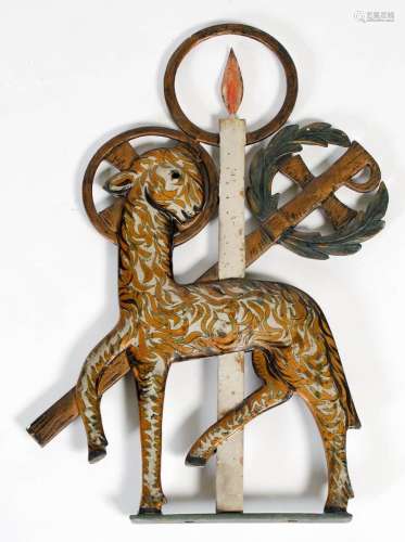 A 20th century painted and gilded metal lamb and cross ornam...