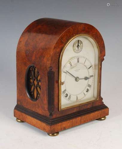 A late 19th/ early 20th century walnut cased mantle clock, `...