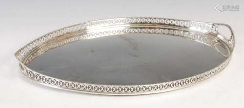 An antique Dutch silver oval tray, Amsterdam marks, with pie...