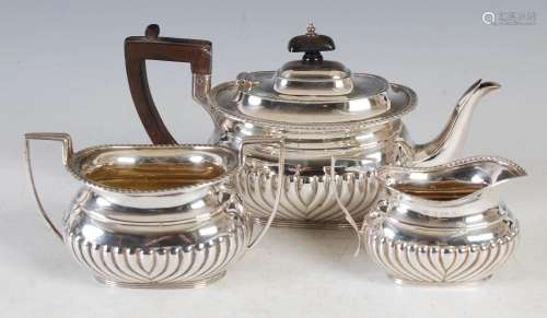 An Edwardian silver bachelors three piece tea set, the teapo...