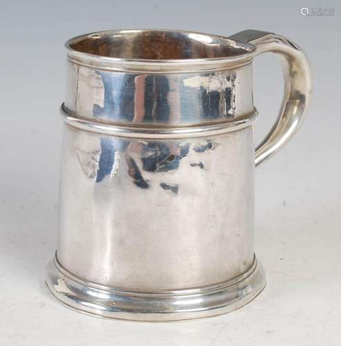 A Georgian silver tankard, of tapered cylindrical form with ...