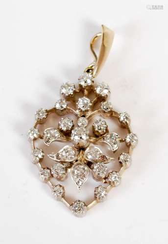 An Edwardian white and yellow metal diamond set open pear sh...