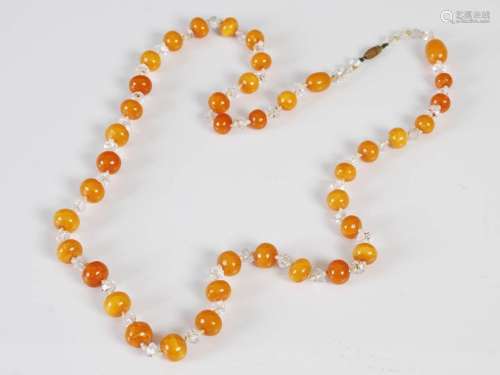 A Butterscotch amber bead necklace, formed from circular bea...