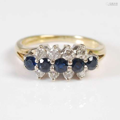 An 18ct yellow gold and white metal sapphire and diamond set...