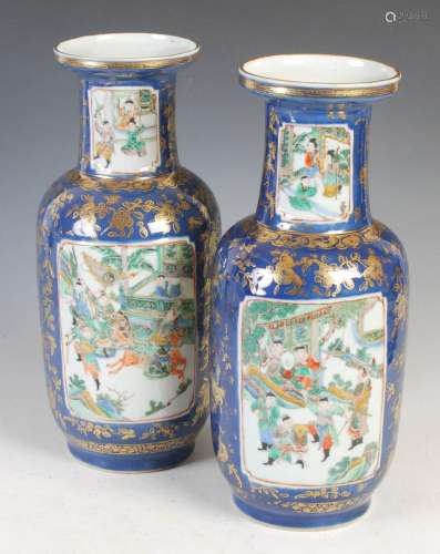 A pair of Chinese porcelain powder blue ground rouleau vases...