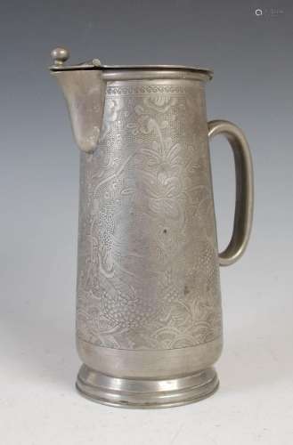 A Chinese pewter jug and cover, with engraved decoration of ...