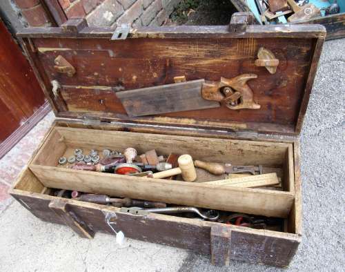 Wooden toolbox with various tools