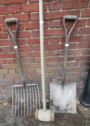 Garden coke fork, a large shovel and a large mallet
