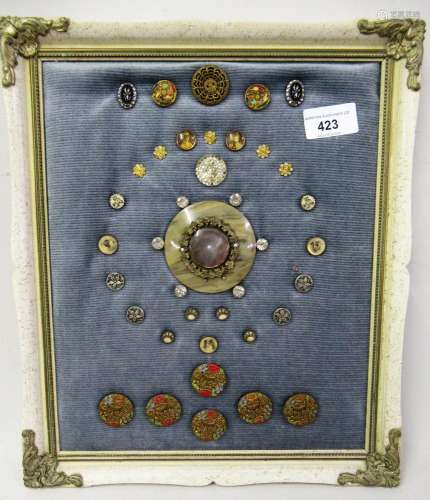 Small collection of various buttons mounted in a rectangular...