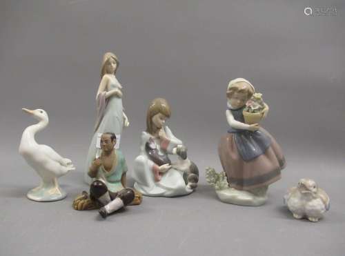 Group of four various Lladro figures with puppies, basket of...