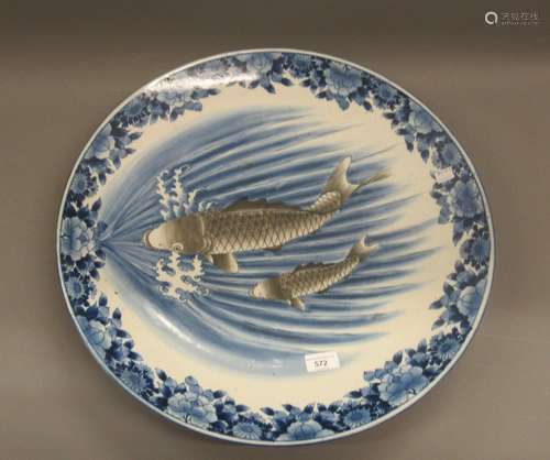 Large Japanese blue and white charger, decorated with figure...