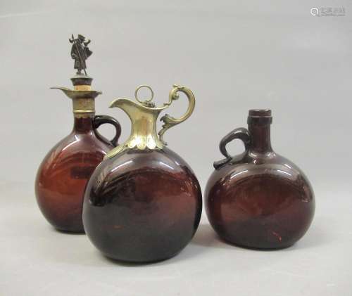 Group of three various 19th Century brown glass decanters