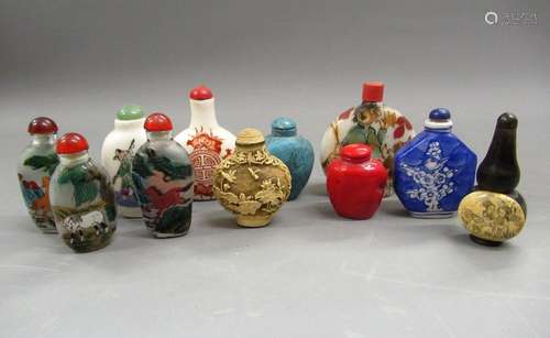 Group of eleven various Chinese porcelain and other snuff bo...